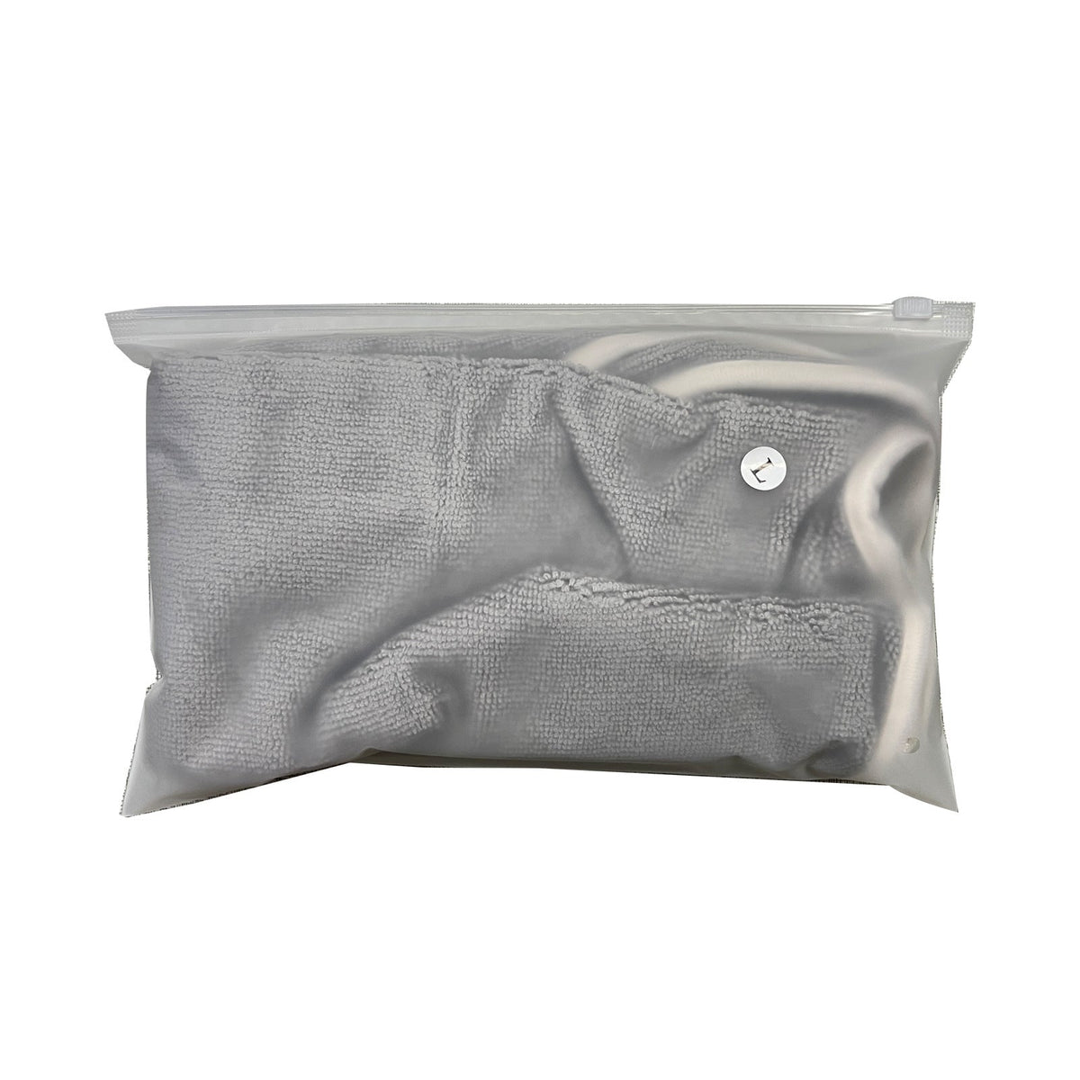 Grey microfibre drying robe folded in its storage bag
